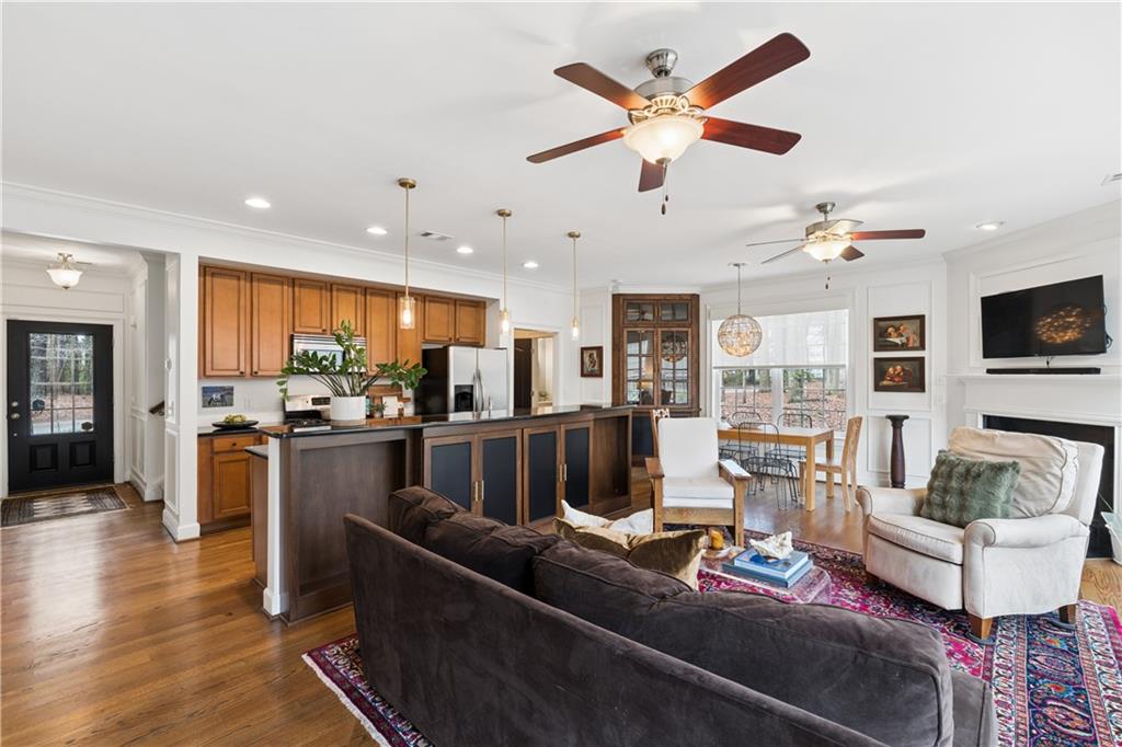 2838 Jordan Oaks Lane Decatur, GA 30033 - Photo 16 of 39 a living room with furniture kitchen view and a wooden floor