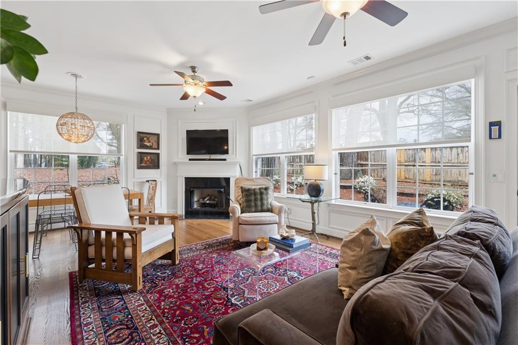 2838 Jordan Oaks Lane Decatur, GA 30033 - Photo 18 of 39 a living room with furniture a fireplace and a flat screen tv