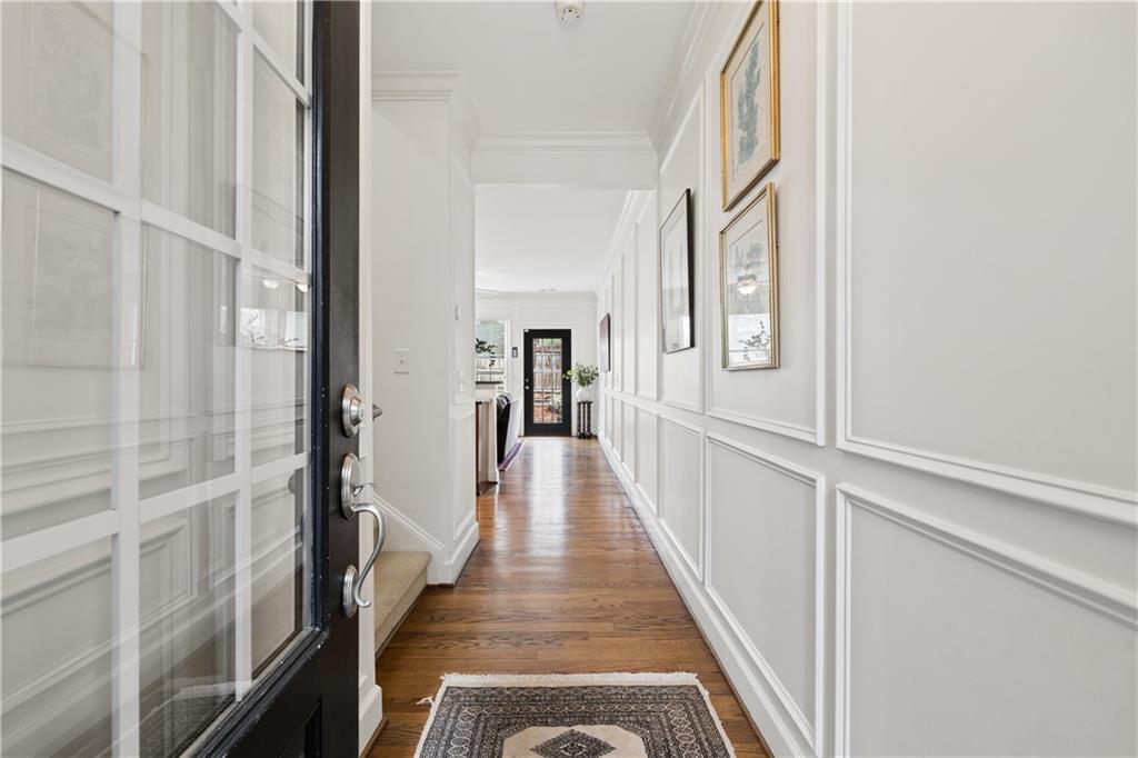 2838 Jordan Oaks Lane Decatur, GA 30033 - Photo 2 of 39 a view of a hallway with wooden floor and staircase