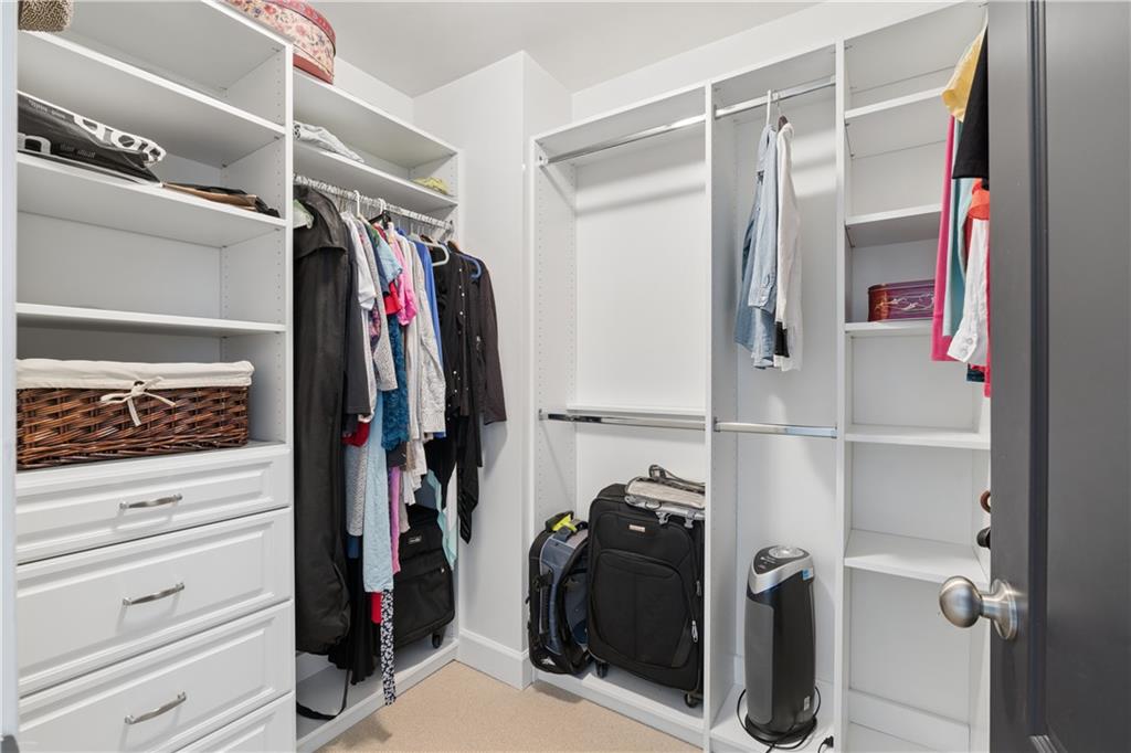 2838 Jordan Oaks Lane Decatur, GA 30033 - Photo 26 of 39 a view of walk in closet with clothes and shoes