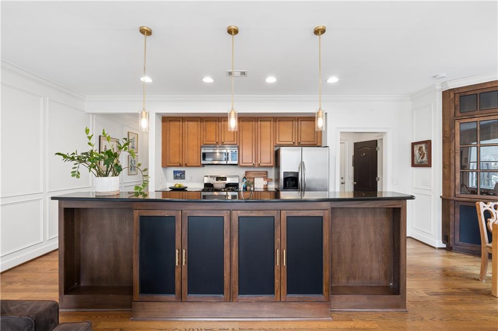 2838 Jordan Oaks Lane Decatur, GA 30033 - Photo 3 of 39 a kitchen with stainless steel appliances granite countertop a sink a stove and a wooden floors