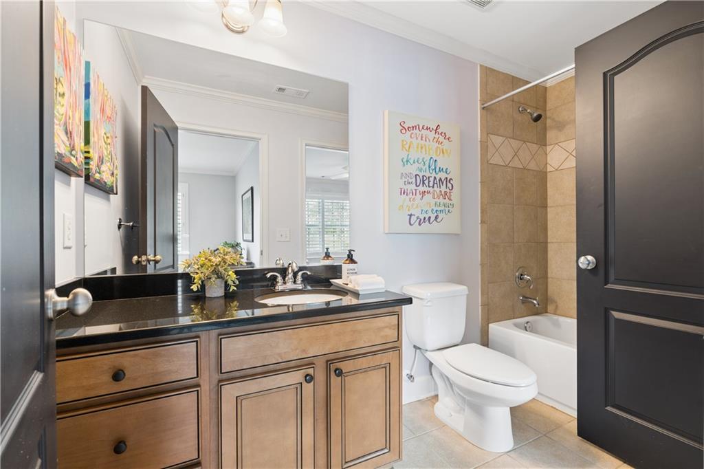 2838 Jordan Oaks Lane Decatur, GA 30033 - Photo 31 of 39 a bathroom with a granite countertop sink toilet and shower