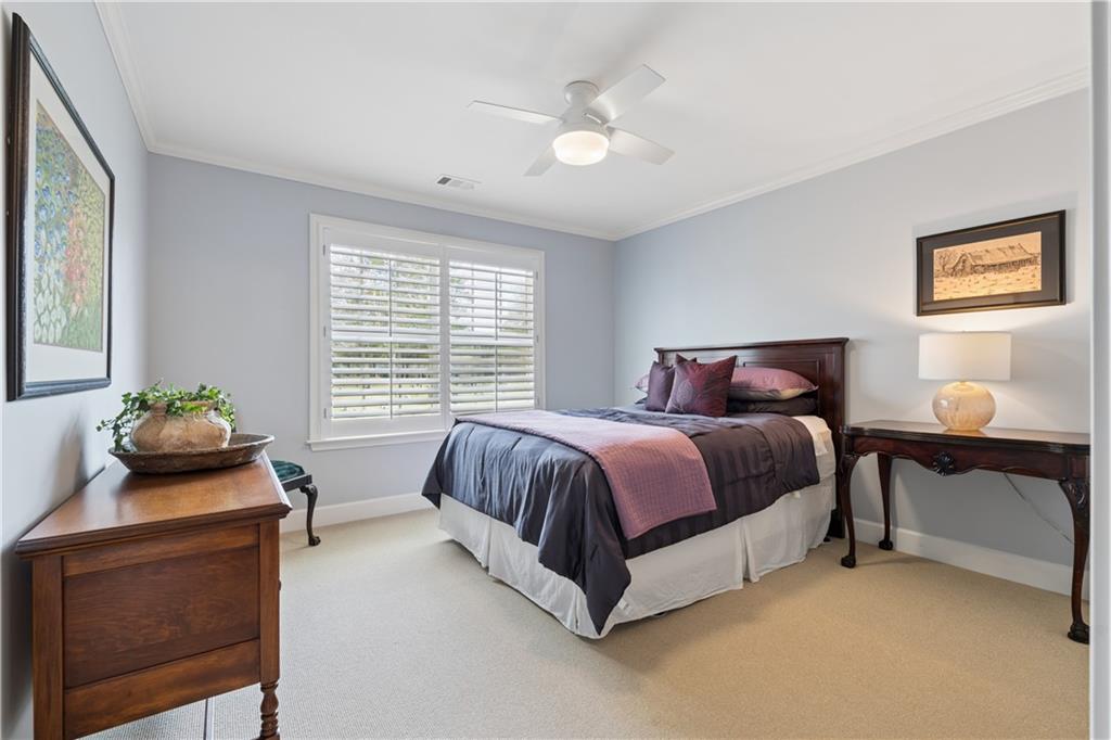 2838 Jordan Oaks Lane Decatur, GA 30033 - Photo 32 of 39 a spacious bedroom with a bed and a table in it