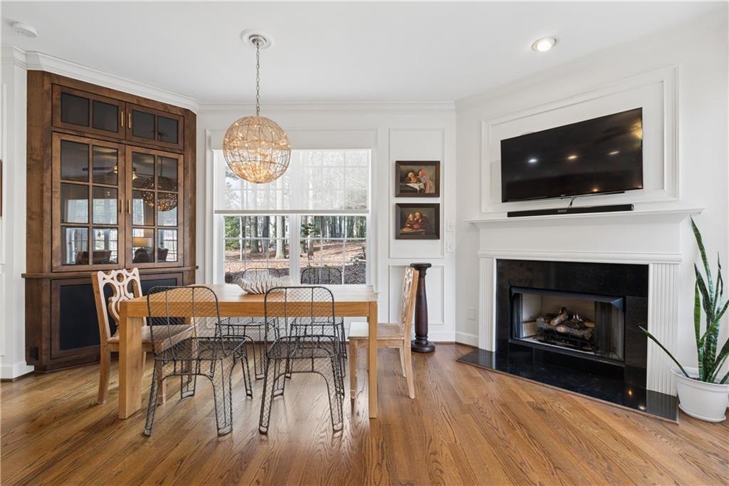 2838 Jordan Oaks Lane Decatur, GA 30033 - Photo 4 of 39 a living room with furniture a flat screen tv and a fireplace