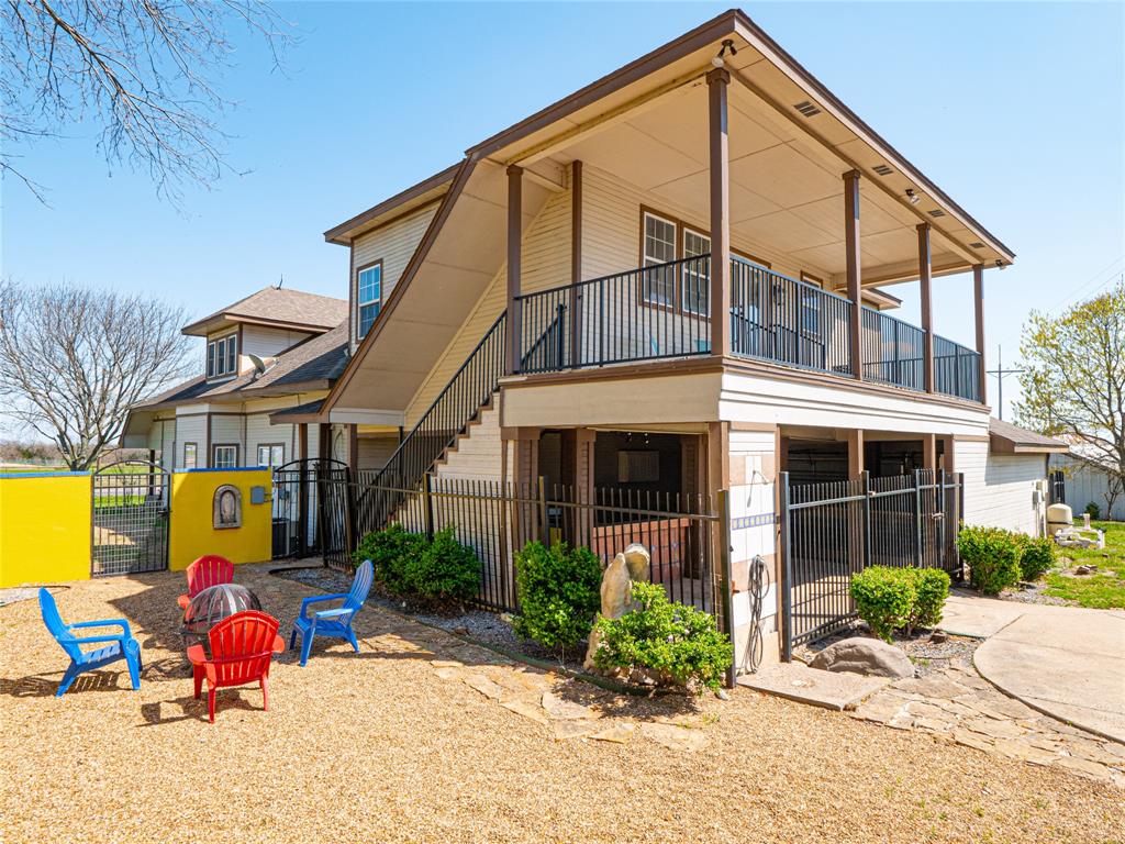 7321 North State Highway Blue Ridge, TX 75424 - Photo 7 of 30 Back of property featuring a gate and a balcony