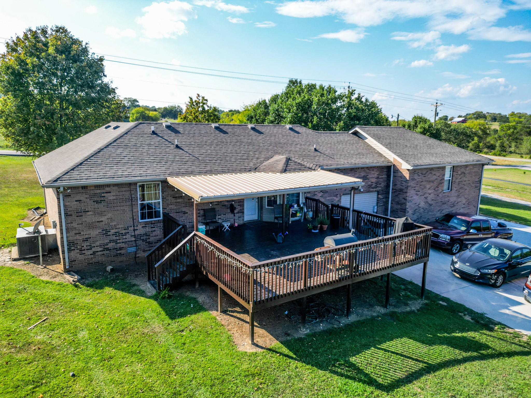1179 Sugar Flat Road Lebanon, TN 37087 - Photo 5 of 42 a view of a house with a wooden deck and a yard