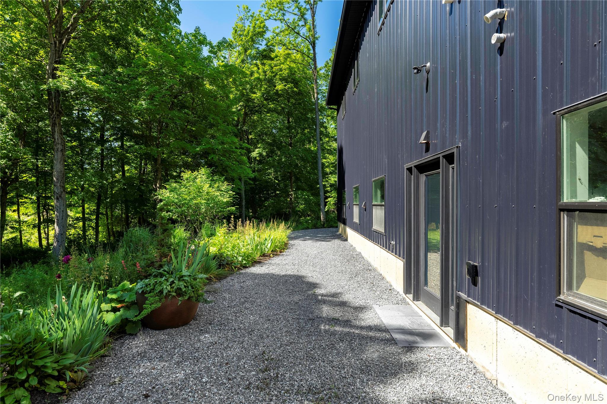 50 Old Albany Post Road North, Unit #1 Cold Spring, NY 10516 - Photo 2 of 18 a view of a pathway with a garden