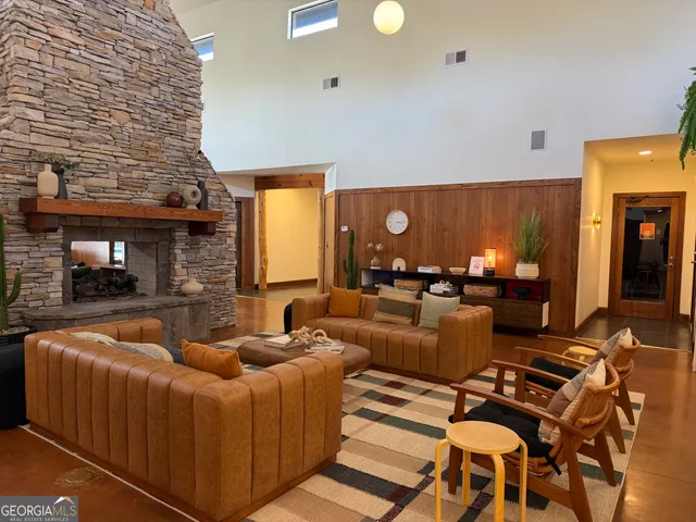 a living room with furniture a lamp and a fireplace