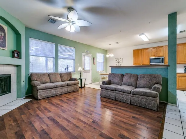 a living room with furniture and a fireplace
