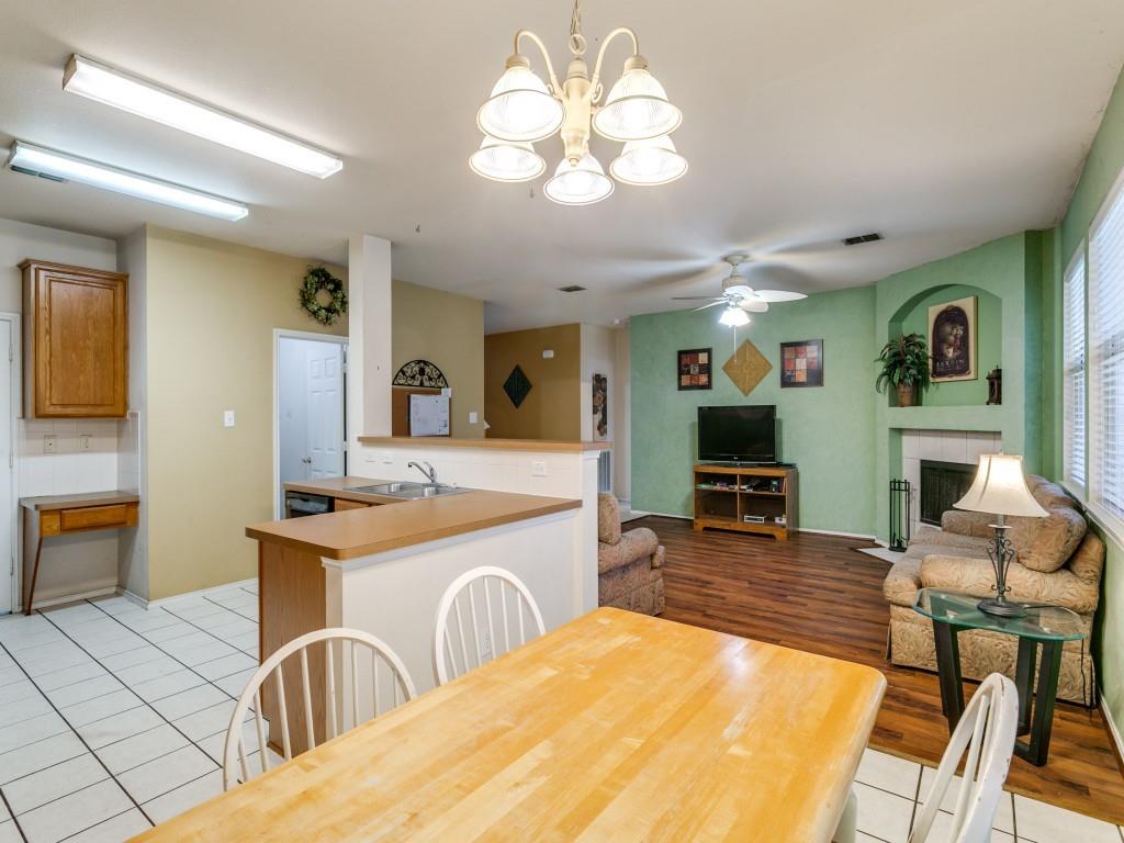 1105 Riverside Drive Lewisville, TX 75067 - Photo 21 of 40 a living room with fireplace furniture and a flat screen tv