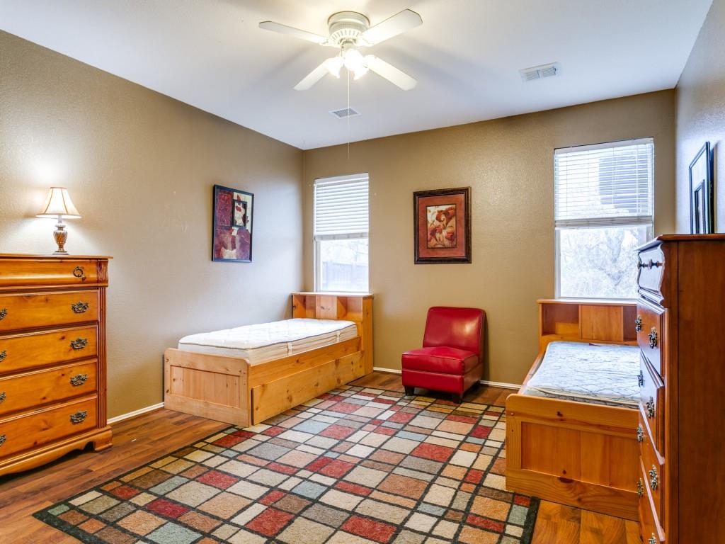 1105 Riverside Drive Lewisville, TX 75067 - Photo 22 of 40 a bedroom with a bed and window
