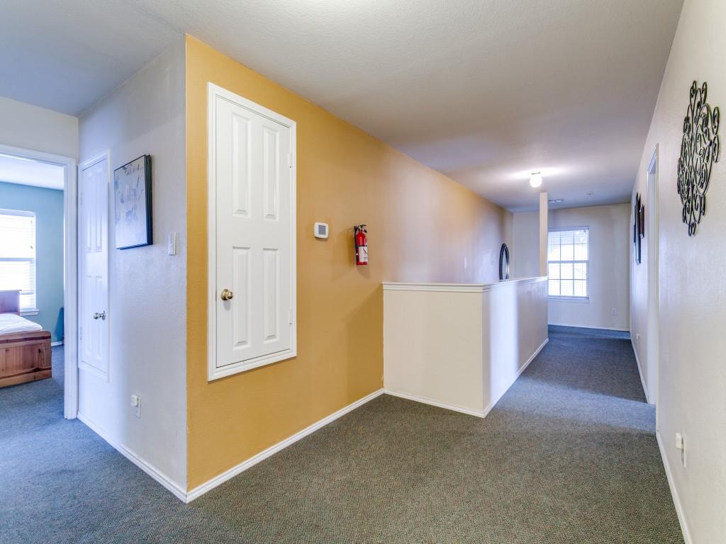1105 Riverside Drive Lewisville, TX 75067 - Photo 25 of 40 a view of a hallway with kitchen and white doors
