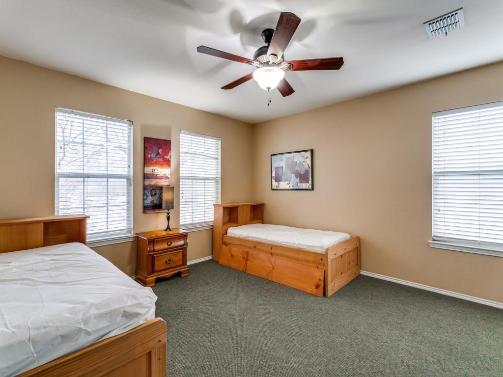1105 Riverside Drive Lewisville, TX 75067 - Photo 26 of 40 a bedroom with a bed and a window