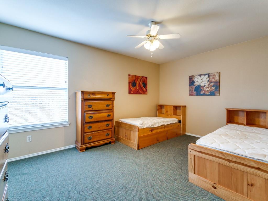 1105 Riverside Drive Lewisville, TX 75067 - Photo 27 of 40 a bedroom with a bed and a window