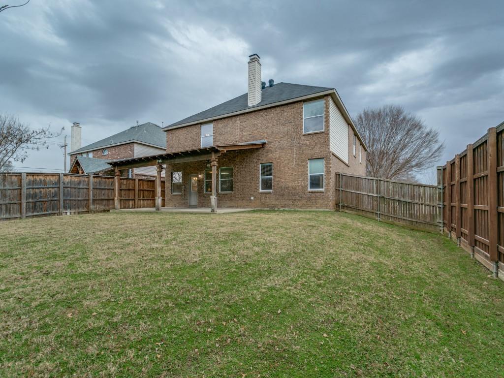 1105 Riverside Drive Lewisville, TX 75067 - Photo 36 of 40 a front view of a house with a garden