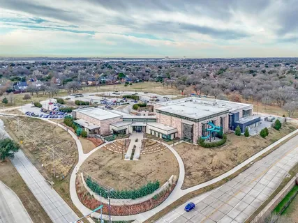 a view of a balcony with an outdoor seating