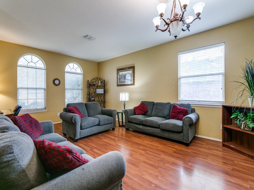1105 Riverside Drive Lewisville, TX 75067 - Photo 6 of 40 a living room with furniture and a large window