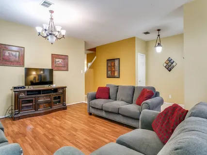 a living room with furniture and a flat screen tv
