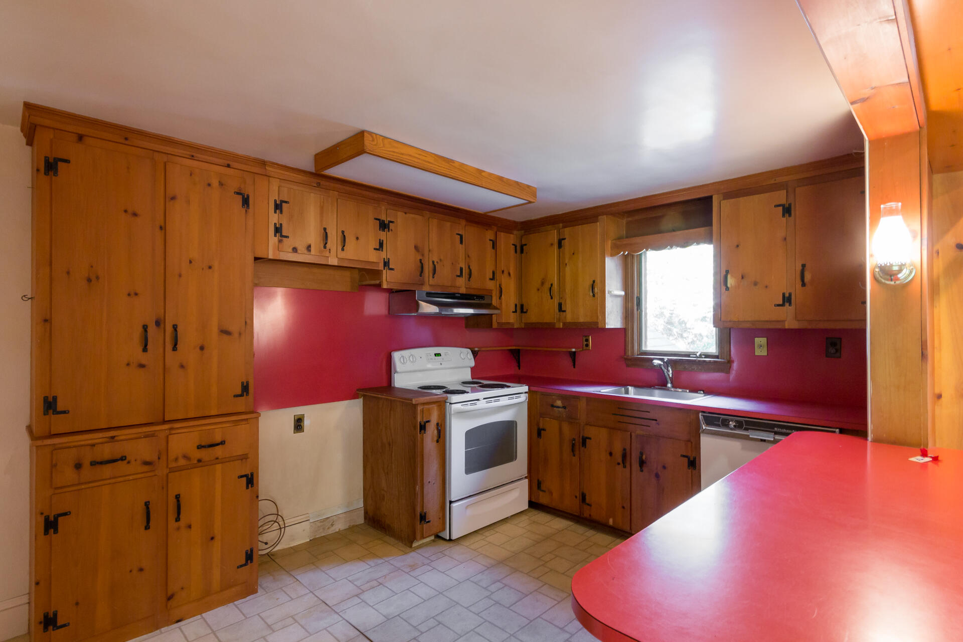 15 Jernegan Pond Road Edgartown, MA 02539 - Photo 13 of 31 a kitchen with kitchen island granite countertop a sink stainless steel appliances and cabinets