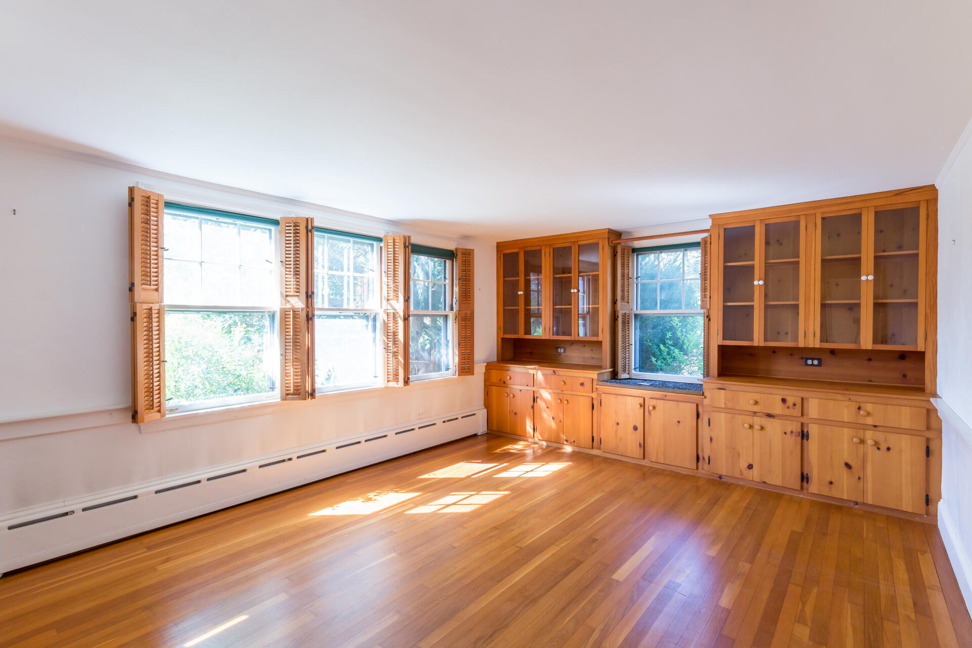 15 Jernegan Pond Road Edgartown, MA 02539 - Photo 17 of 31 an empty room with wooden floor and windows