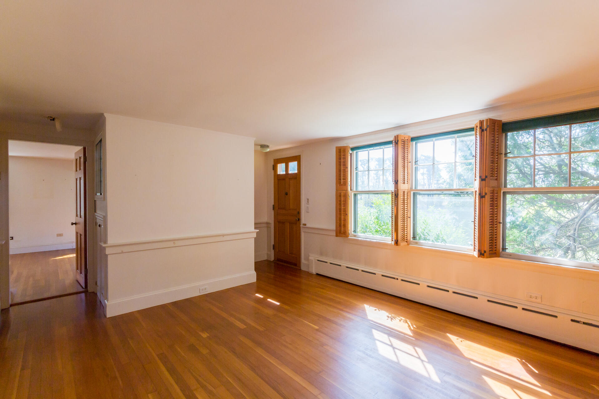 15 Jernegan Pond Road Edgartown, MA 02539 - Photo 19 of 31 a view of an empty room with a window and wooden floor