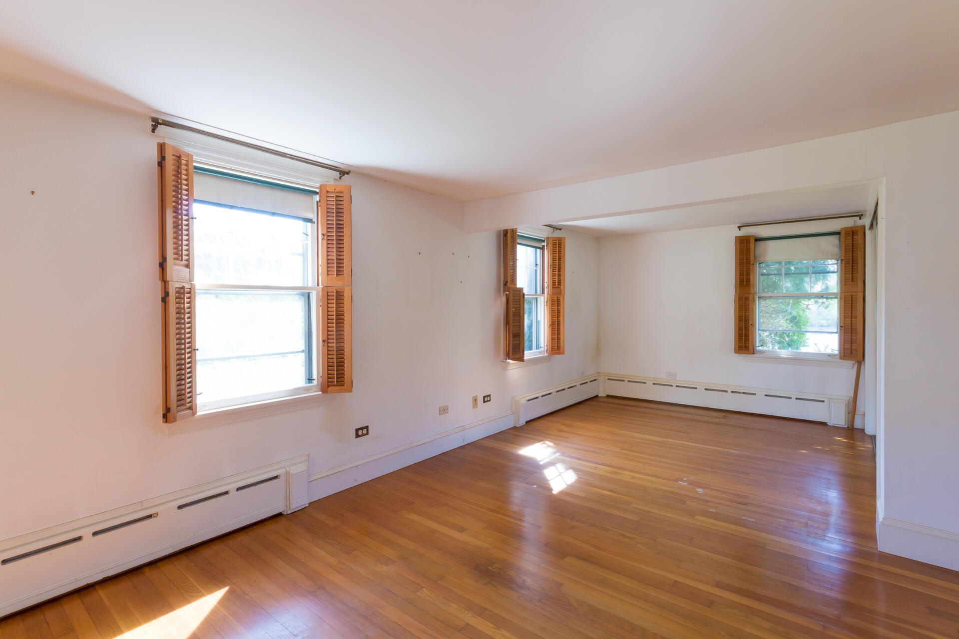 15 Jernegan Pond Road Edgartown, MA 02539 - Photo 20 of 31 a view of an empty room with wooden floor and a window