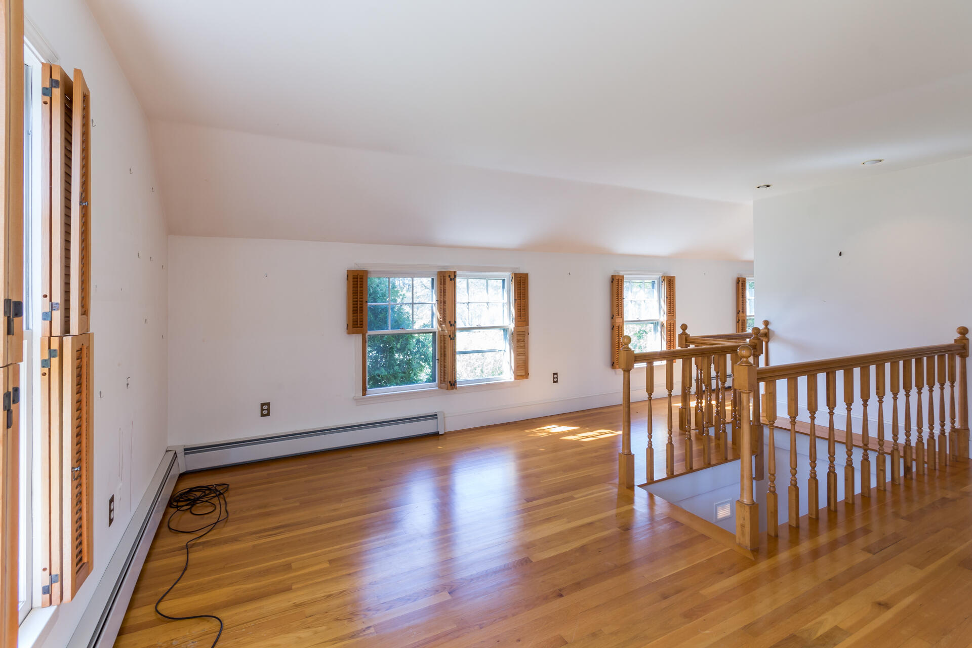 15 Jernegan Pond Road Edgartown, MA 02539 - Photo 24 of 31 a view of an empty room with wooden floor and a window