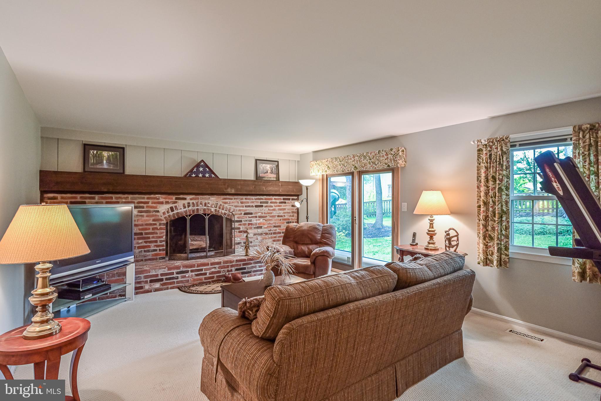 9010 Parliament Drive Burke, VA 22015 - Photo 27 of 40 Family room with brick wood burning fireplace