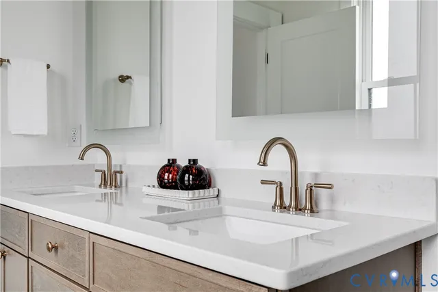 a kitchen with sink a faucet and cabinets