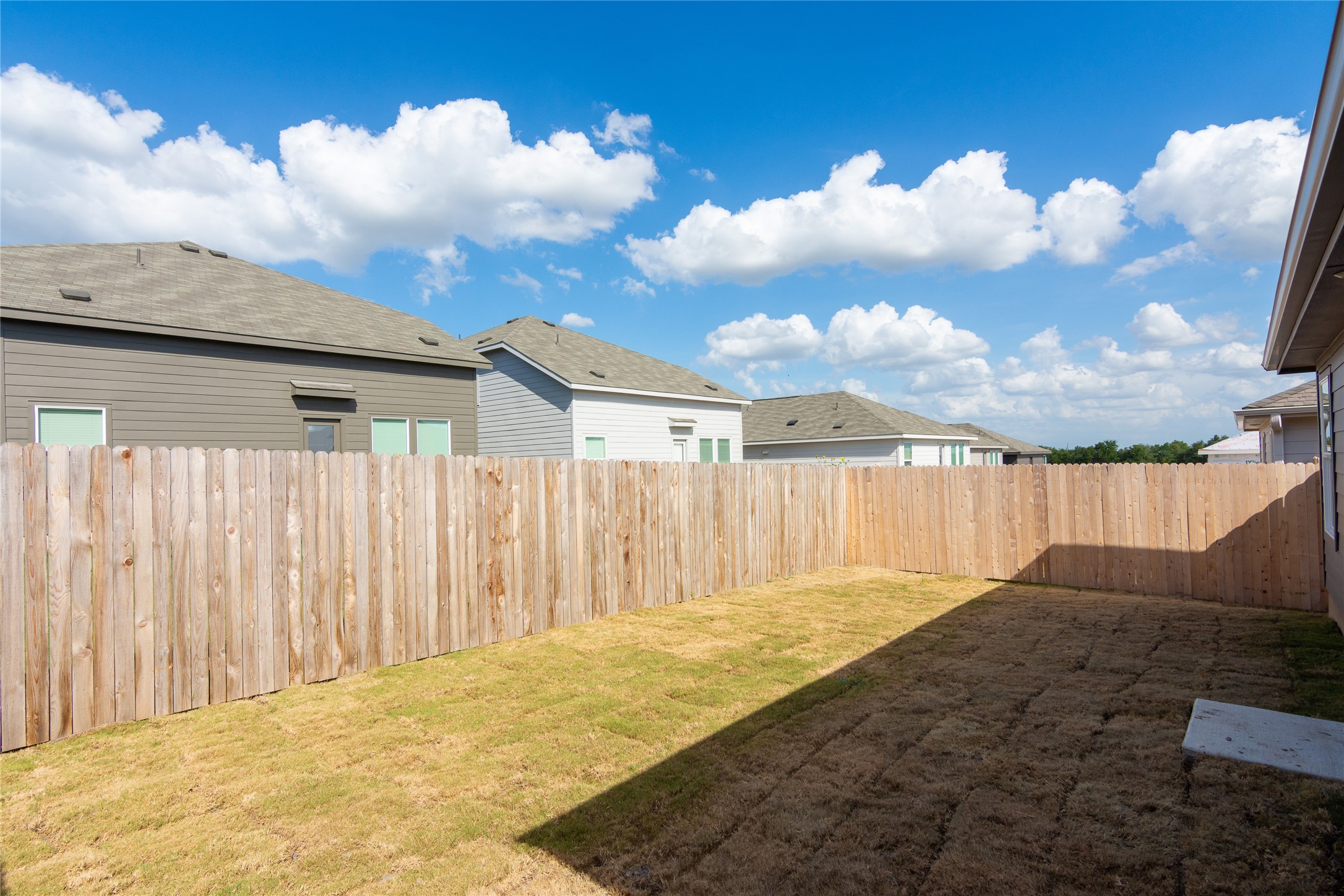 149 Star Packer Lane Jarrell, TX 76537 - Photo 26 of 30 Secure backyard offers ample space for outdoor enjoyment and privacy.