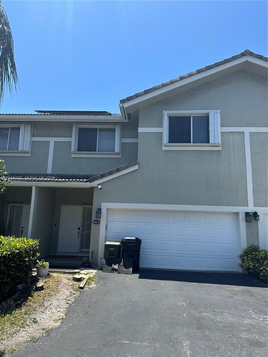 5402 Pointe Villa Drive, Unit B Lighthouse Point, FL 33064 - Photo 1 of 35 a backyard of a house