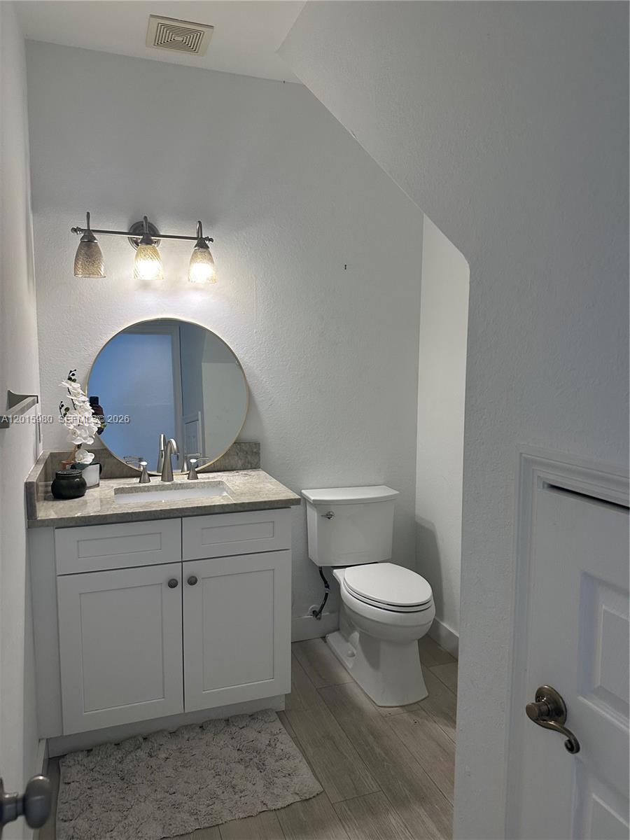 5402 Pointe Villa Drive, Unit B Lighthouse Point, FL 33064 - Photo 5 of 35 a bathroom with a sink and a toilet