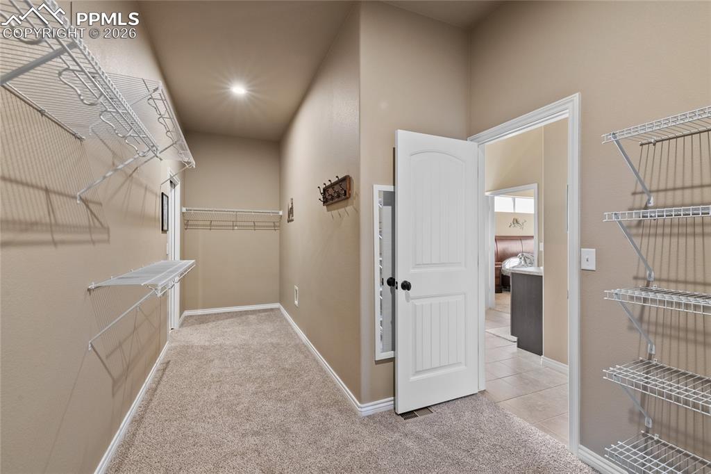 3718 Sky Rim Court Colorado Springs, CO 80908 - Photo 28 of 49 Huge walk-through closet from primary bath into the laundry room.
