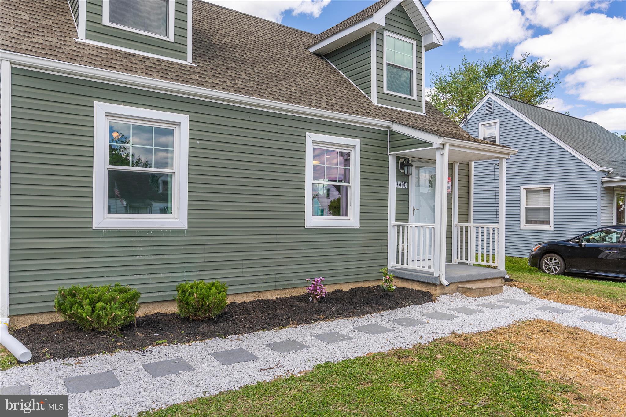 7400 Belclare Road Baltimore, MD 21222 - Photo 27 of 33 a front view of a house with garden