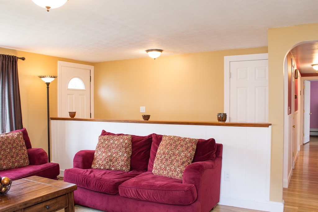 75 William Street Walpole, MA 02081 - Photo 11 of 27 a living room with furniture and a couch