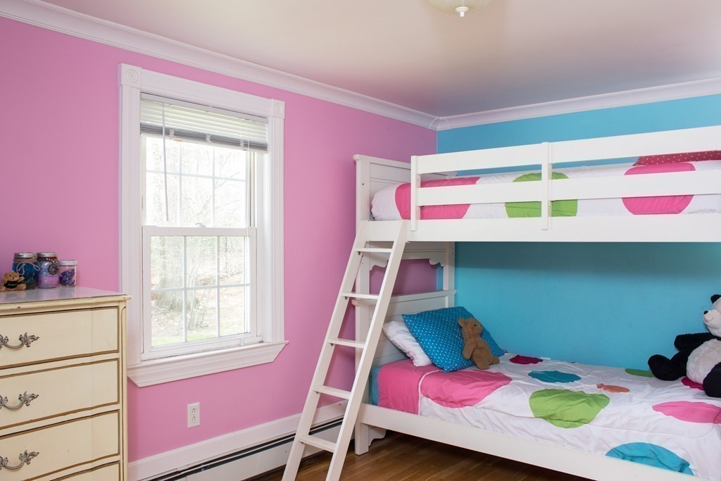 75 William Street Walpole, MA 02081 - Photo 14 of 27 a bedroom with a bed and dresser