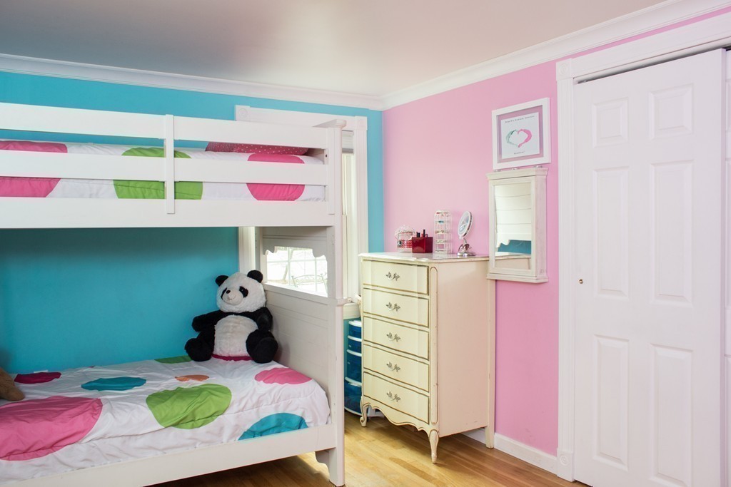 75 William Street Walpole, MA 02081 - Photo 15 of 27 a bedroom with a bed and a dresser
