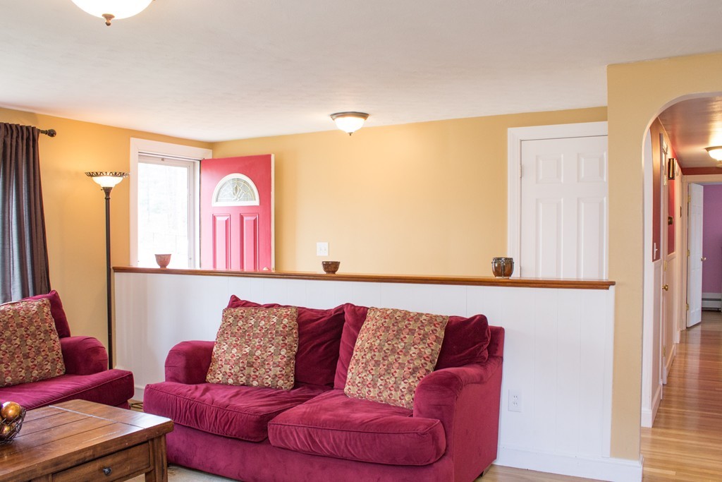 75 William Street Walpole, MA 02081 - Photo 10 of 27 a living room with furniture and a couch