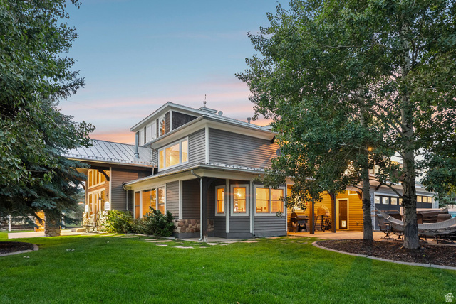 8650 Redden Road Park City, UT 84098 - Photo 50 of 71 Multi-level exterior with gray siding and stone accents, featuring a metal roof