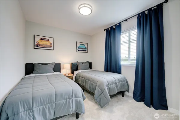 a view of a hallway with wooden floor and entryway