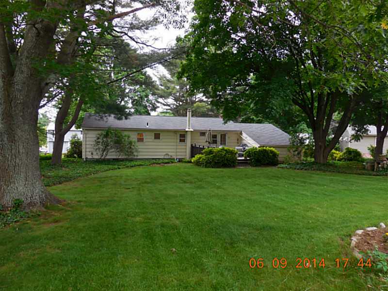 31 Baldwin Road Warwick, RI 02886 - Photo 3 of 25 Exterior Back. More than 1/2 acre of land backing up to the woods. Sit on your deck and enjoy nature at your doorstep. Mary flowering and ornamental plants cultivated over 50 years by the home s only owners.