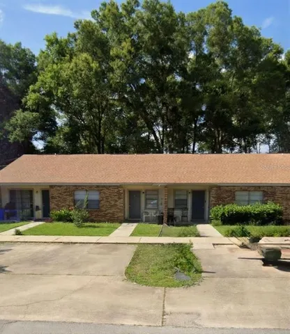 a view of front a house with a garden
