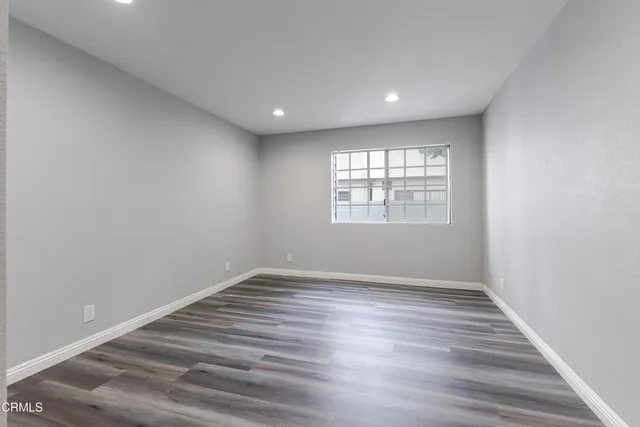 a view of room window and wooden floor