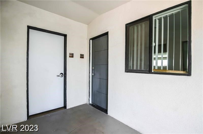 2201 Fairfield Avenue, Unit 9 Las Vegas, NV 89102 - Photo 3 of 7 Doorway to property with stucco siding