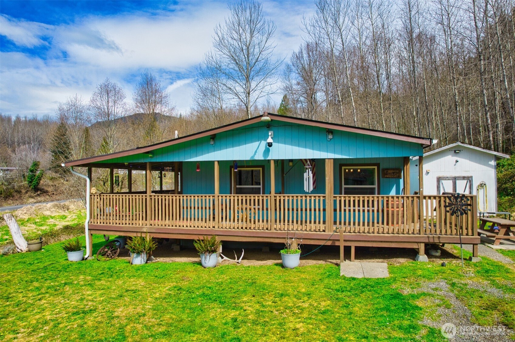 404 Meade Hill Road Glenoma, WA 98336 - Photo 1 of 40 a front view of a house with a garden