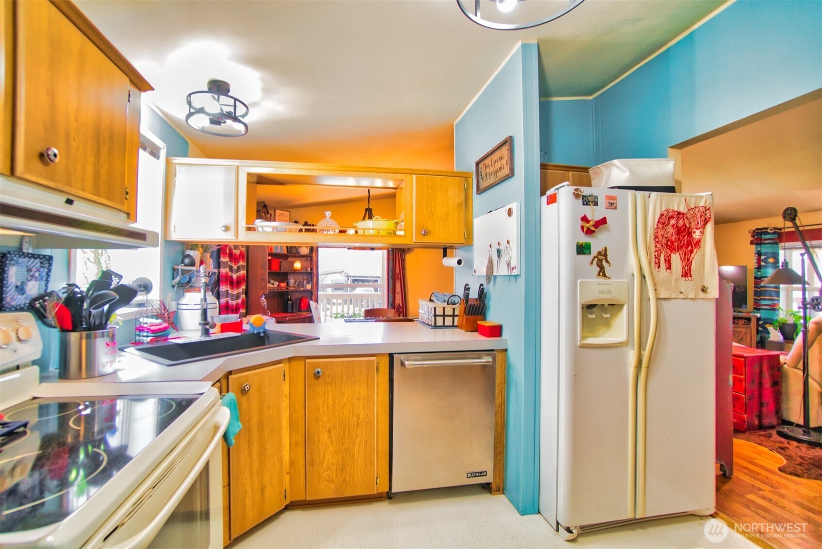 404 Meade Hill Road Glenoma, WA 98336 - Photo 15 of 40 a view of a kitchen with fridge and a sink