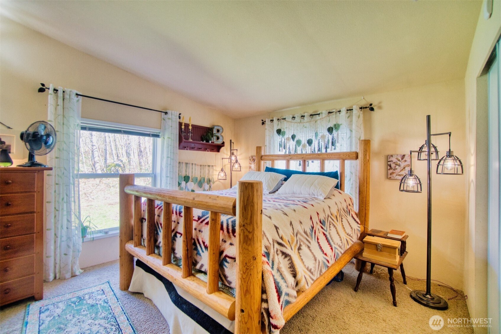 404 Meade Hill Road Glenoma, WA 98336 - Photo 22 of 40 a bed sitting in a bedroom next to a window