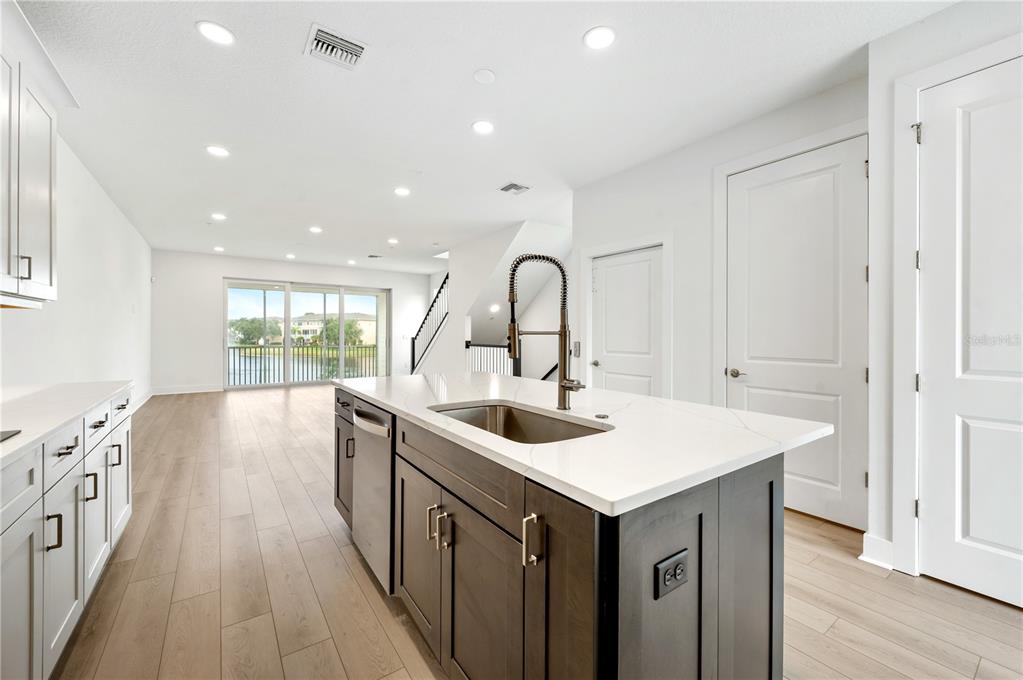 9973 Key Haven Road Seminole, FL 33777 - Photo 21 of 59 a kitchen with a sink and stove