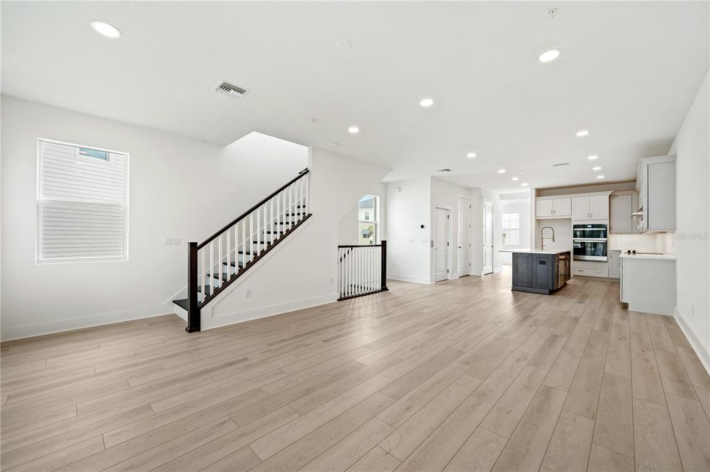 9973 Key Haven Road Seminole, FL 33777 - Photo 22 of 59 a view of a big room with wooden floor and windows