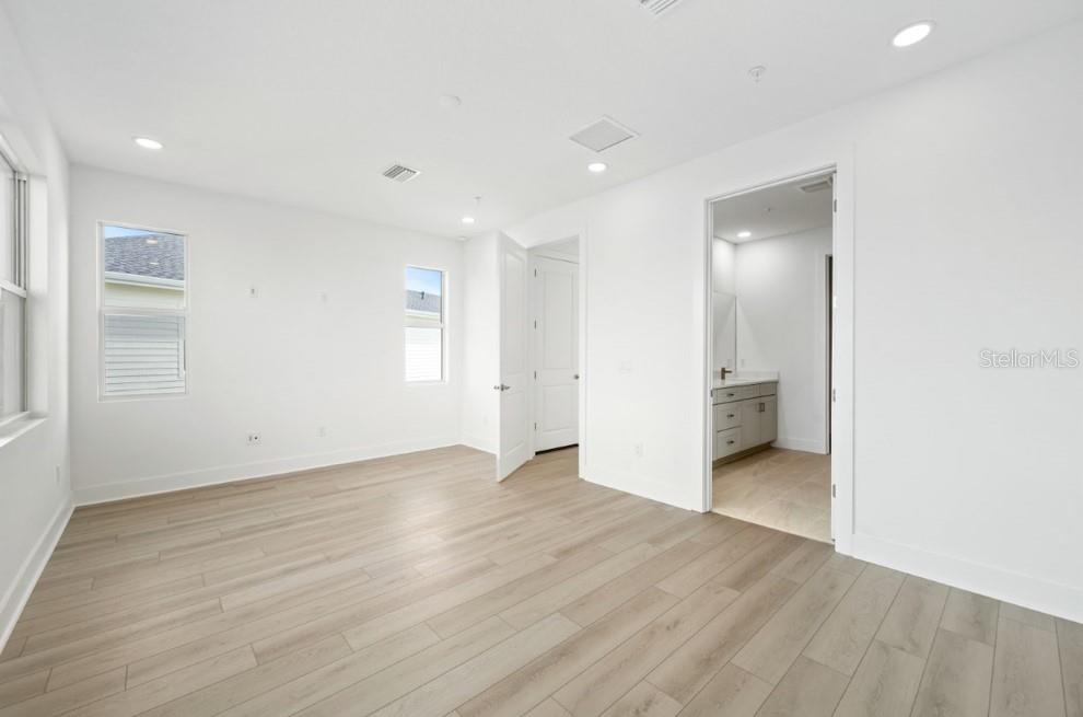 9973 Key Haven Road Seminole, FL 33777 - Photo 33 of 59 an empty room with wooden floor and windows